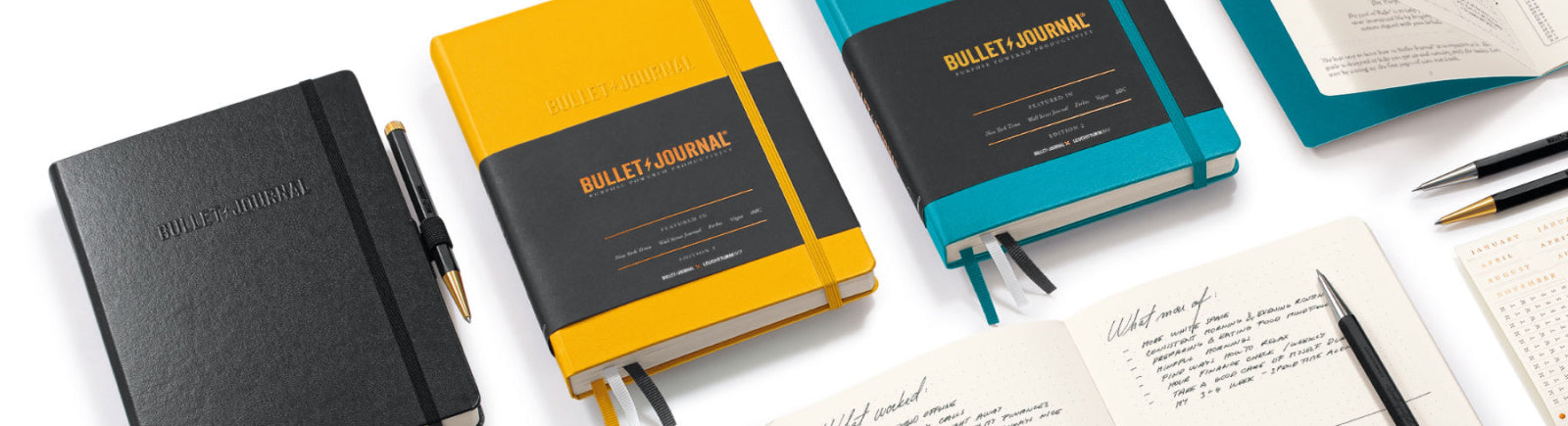 Collection of Bullet Journals - Yellow, Blue, Black