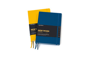 Two hardcover notebooks from New Work Journal, one in dark blue and one in yellow, both with black covers and elastic closures, shown on a white background.
