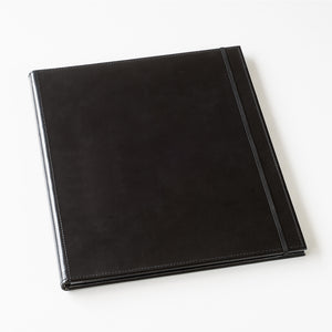 Black leather-bound album on a white background