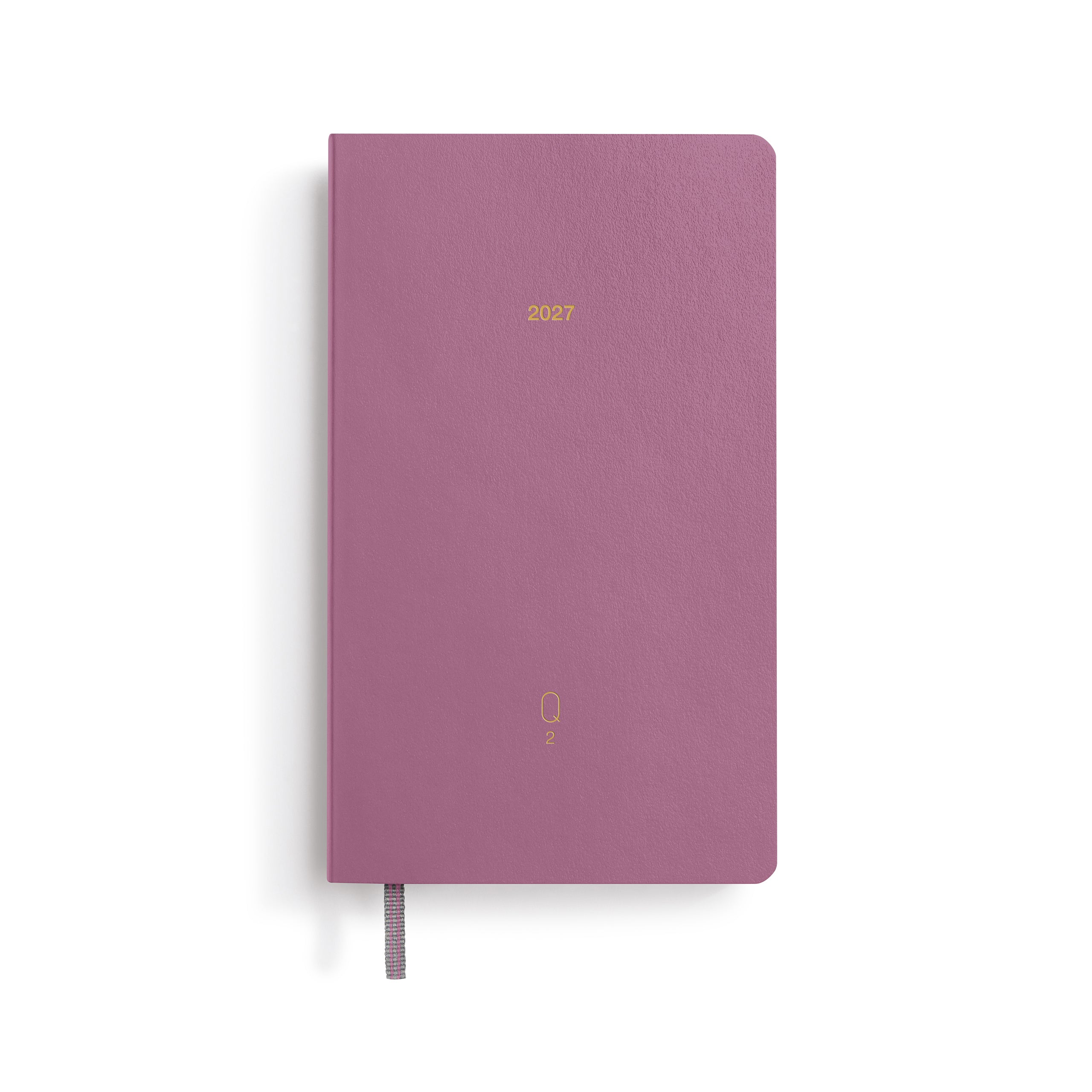 Purple notebook with '2023' printed on a white background