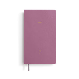 Purple notebook with '2023' printed on a white background