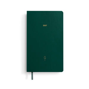 Green notebook with '2027' printed on the cover on a white background