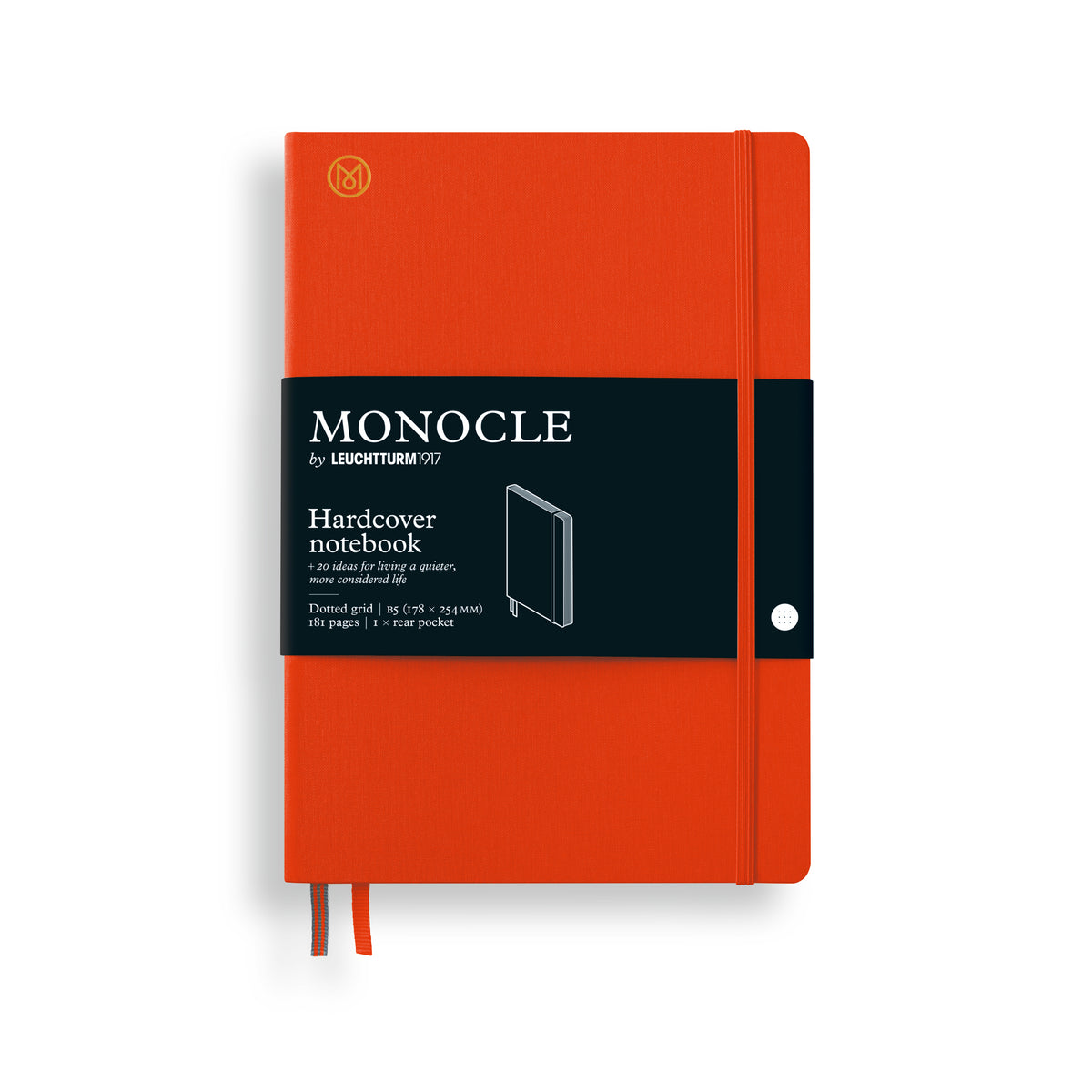 A Monocle Hardcover notebook in a vibrant orange-red color, featuring a black paper band with white text and a small white rivet on the front cover.