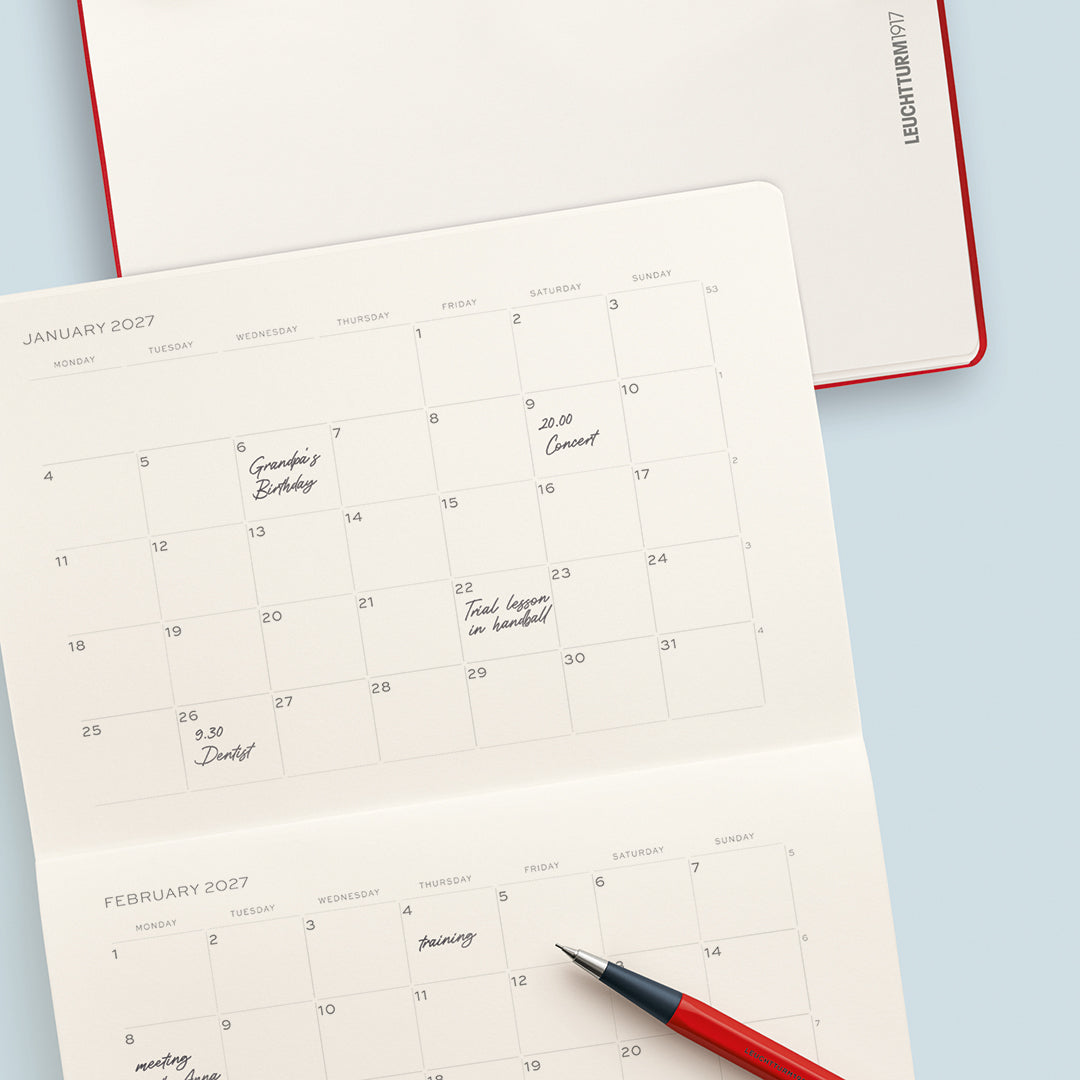 Calendar with handwritten notes on a light blue background
