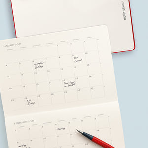 Calendar with handwritten notes on a light blue background