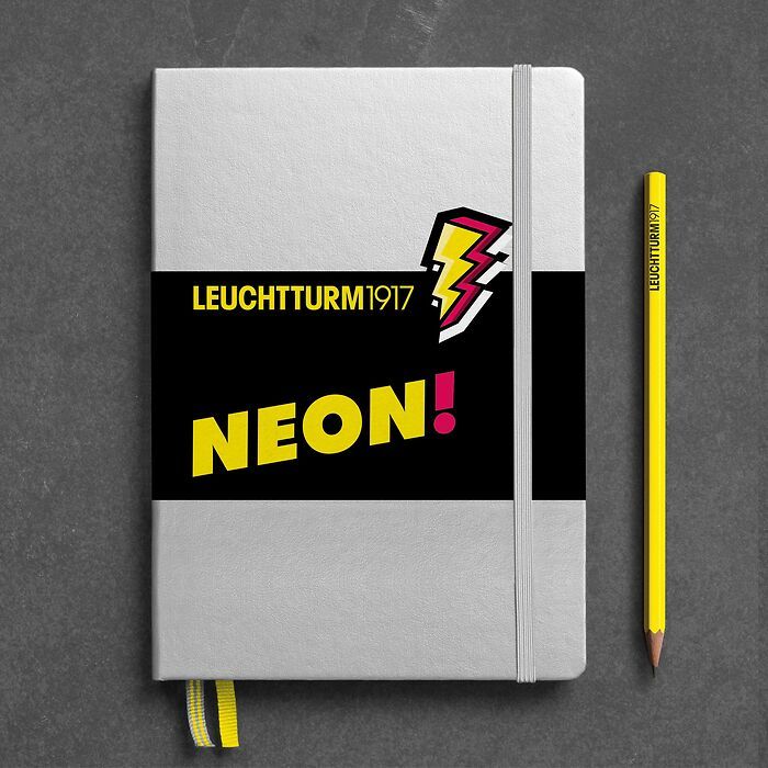 Notebook Medium (A5), Hardcover, 251 numbered pages, Silver & Neon Yellow. dotted